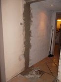 Mur-reparation efter nedtagning af dørkarm.